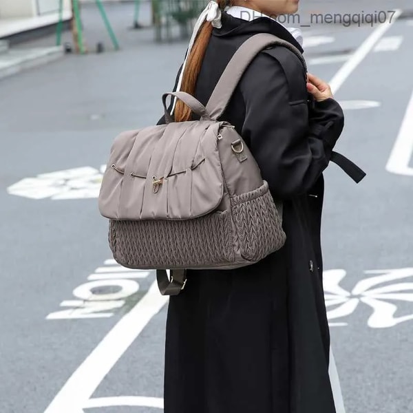 DHgate Bolso maternal impermeable Rese&ntilde;a